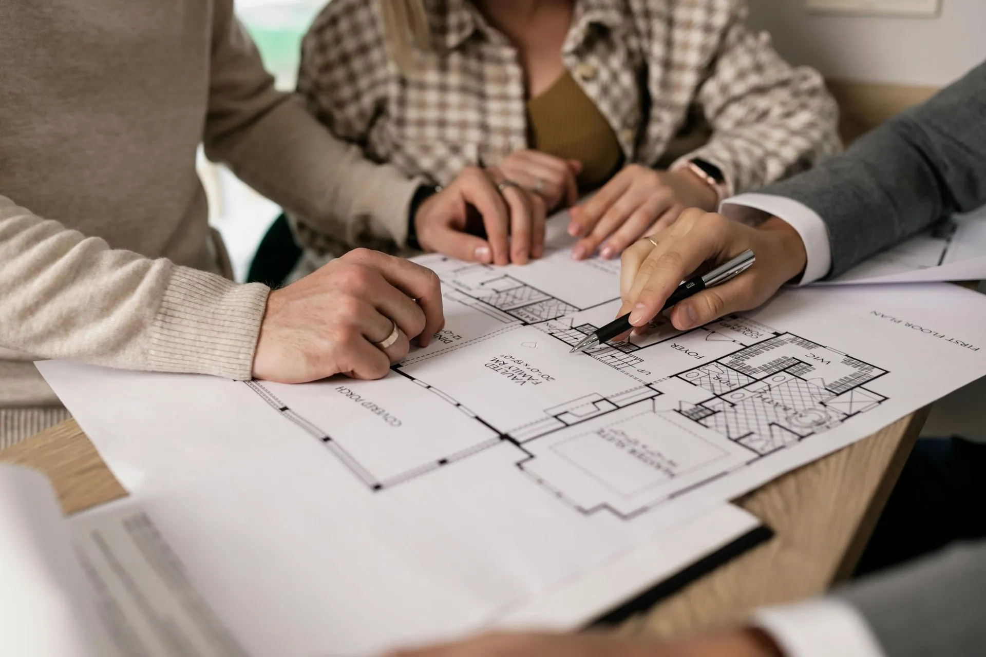 Sydney design and construct builder reviewing architectural plans with client at concept stage