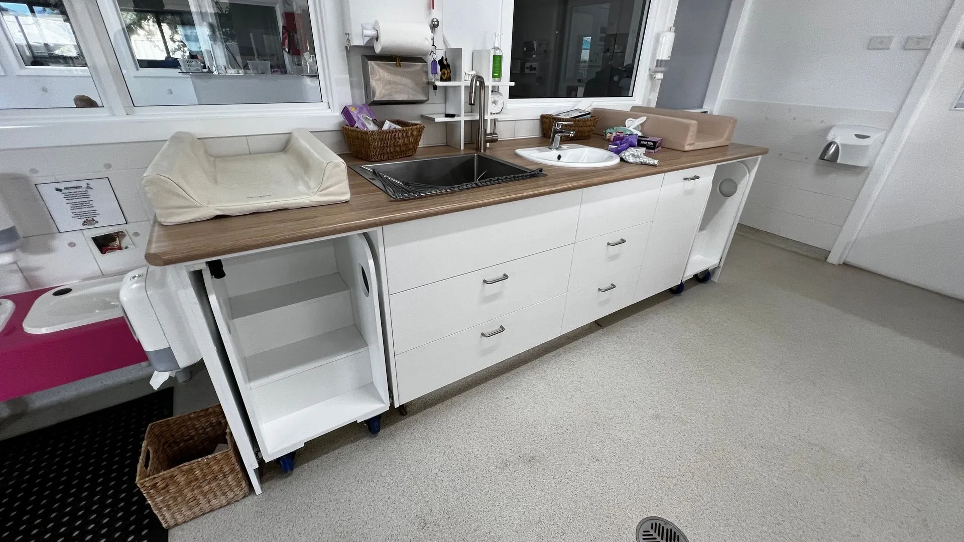 Childcare centre nappy change bench with storage drawers and steps