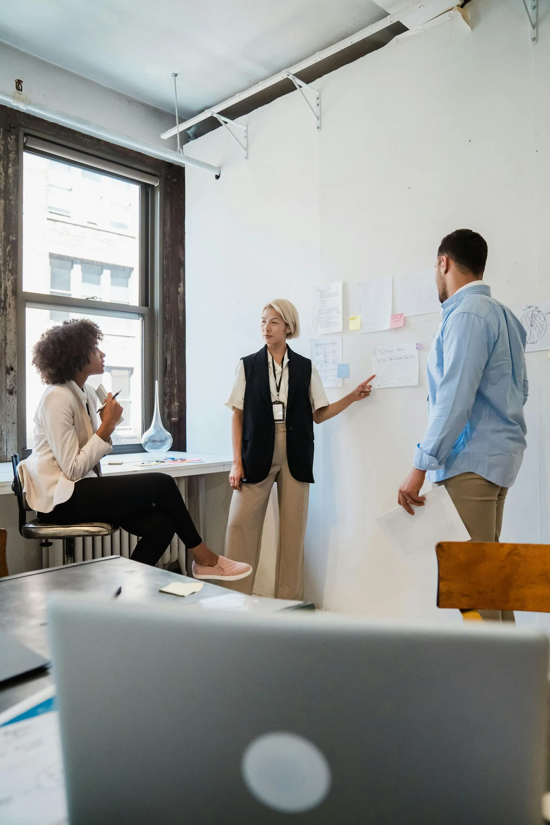 Office team planning a fitout at a whiteboard