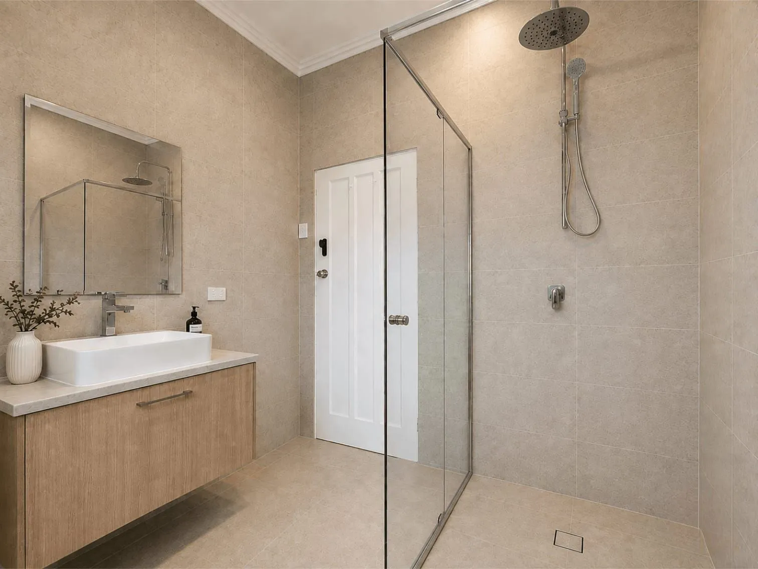 Renovated bathroom with frameless glass shower, timber vanity and vessel basin, Wyong whole home renovation